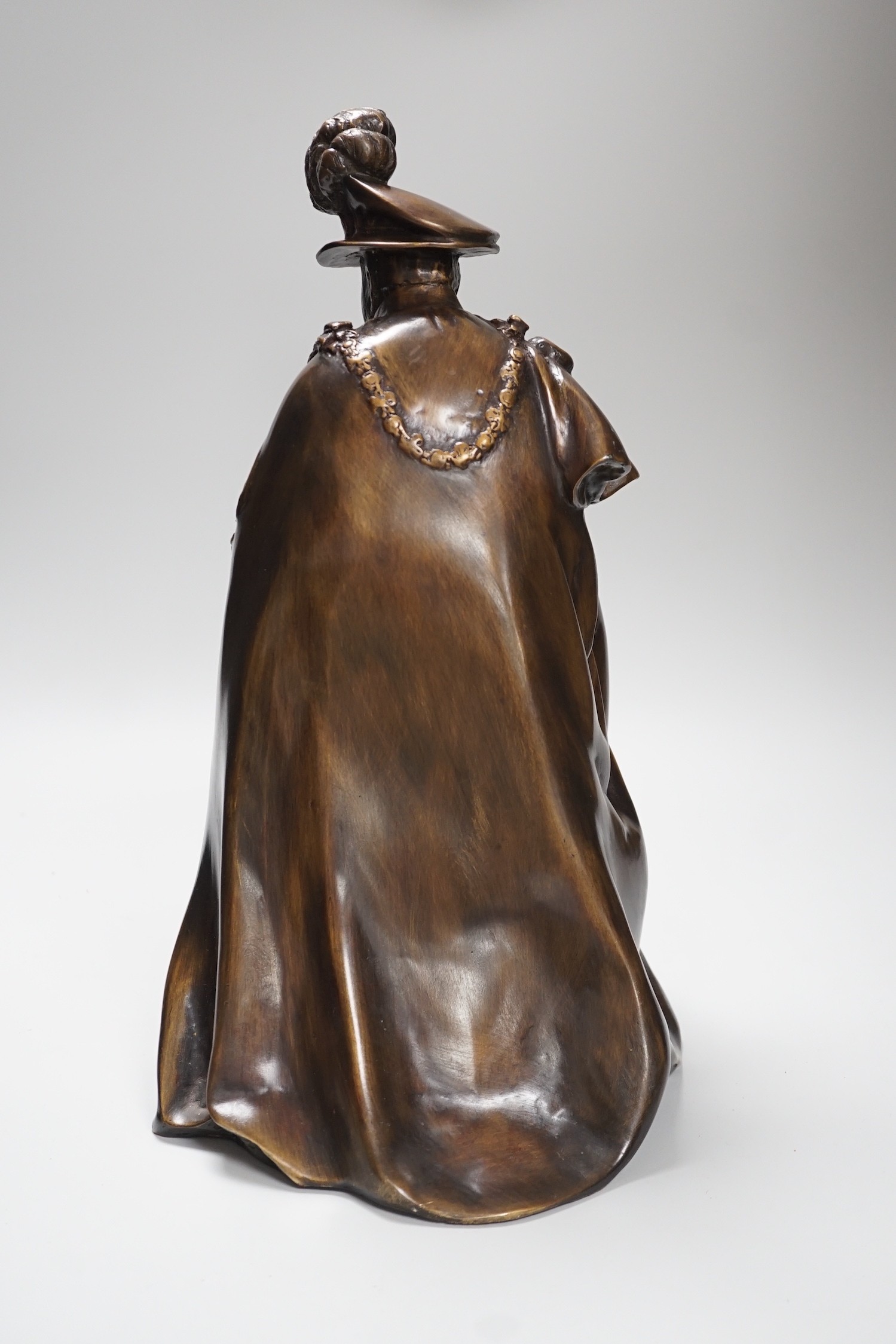 A bronze figure of Winston Churchill wearing the robes of a Knight of the Garter, 38cm